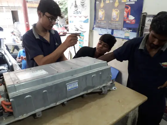 Hybrid battery pack opened on the workbench for servicing